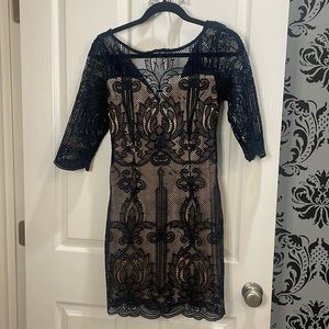 Navy lace mini dress with sleeves and nude lining
